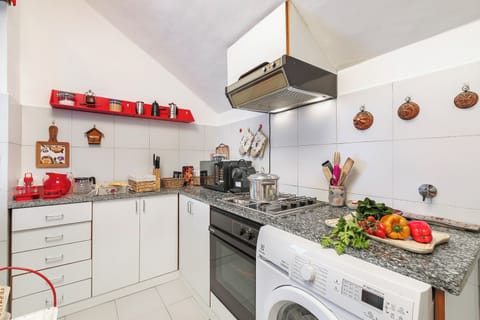 Standard Apartment, Multiple Bedrooms (Il Balcone Sulle Alpi ski in ski out) | Private kitchen | Fridge, oven, stovetop, coffee/tea maker