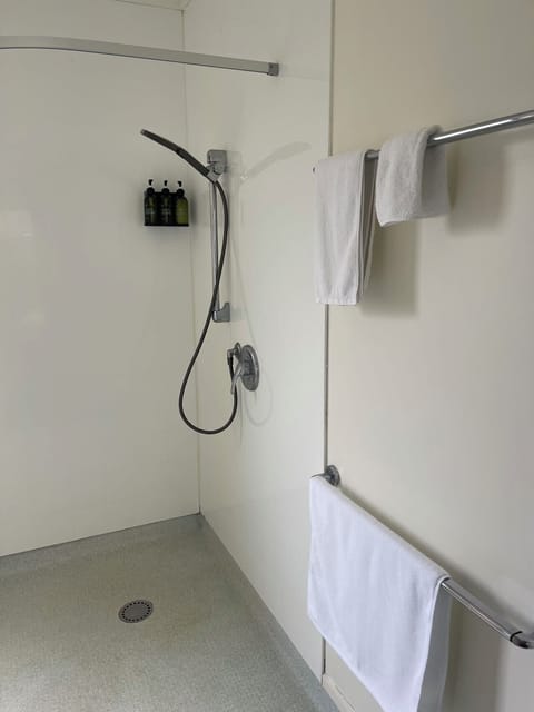 Bathroom | Shower, hair dryer, towels, shampoo