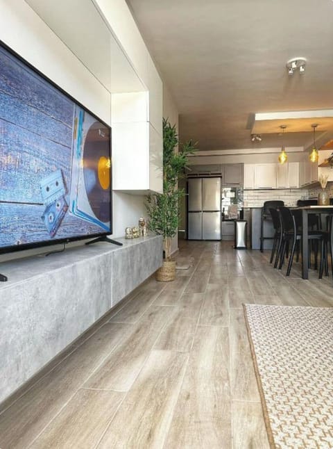 Apartment, 3 Bedrooms, Air conditioning, Beachside | Living area | Flat-screen TV