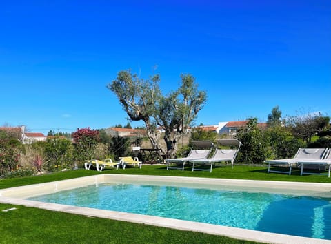 Seasonal outdoor pool, open 8:30 AM to 9:30 PM, pool umbrellas