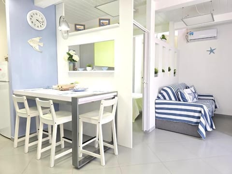 City Duplex, Partial Sea View | Living area | 40-inch Smart TV with digital channels