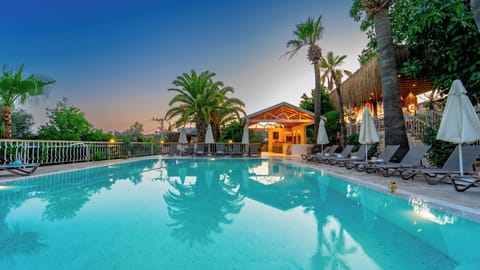 Outdoor pool, open 9 AM to 7 PM, pool umbrellas, sun loungers