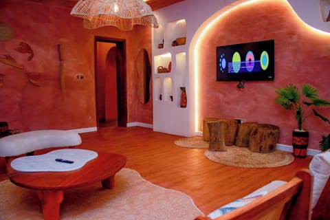 Luxury Suite, Balcony, Pool View | Living area | TV