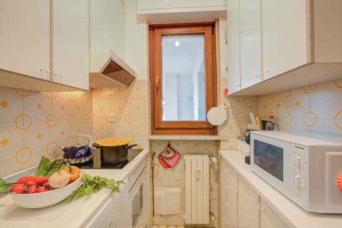 Standard Apartment, Multiple Bedrooms (Appartamento Vista Alta) | Private kitchen | Fridge, microwave, oven, stovetop