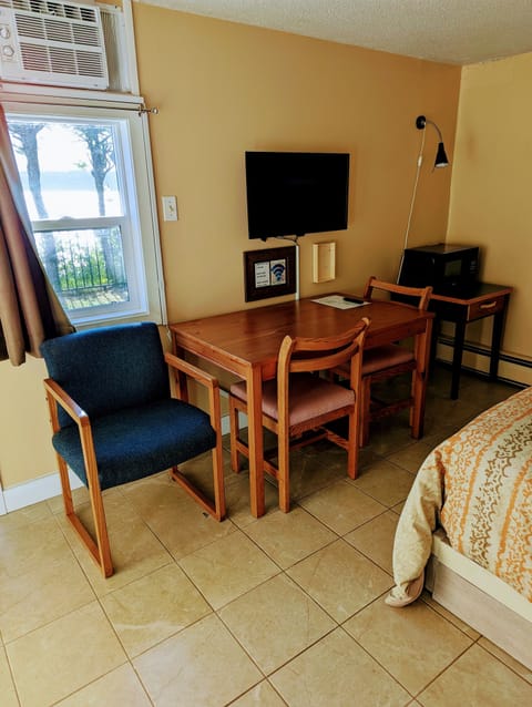 Oceanfront Budget Room 1 Queen Downstairs | Premium bedding, desk, laptop workspace, free WiFi