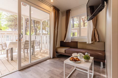 Superior Bungalow, Patio | Living room | 32-inch flat-screen TV with digital channels