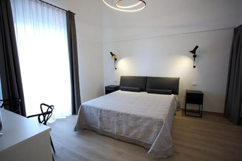 Deluxe Room, Balcony, City View | Blackout drapes, free WiFi