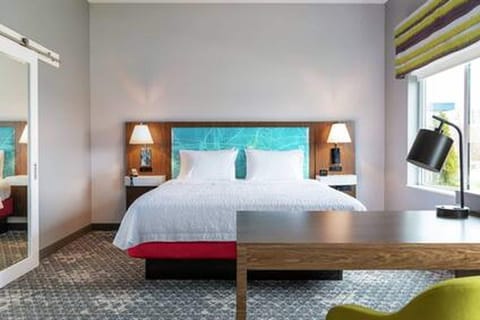 Desk, laptop workspace, blackout drapes, iron/ironing board