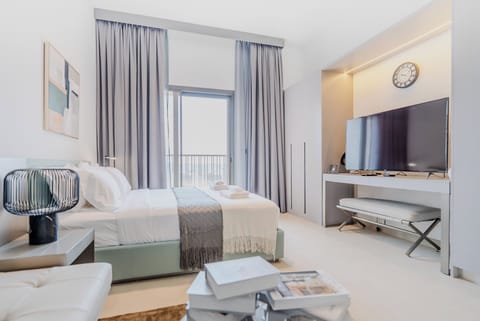 Deluxe Studio, Balcony, City View | Living area | 55-inch Smart TV with digital channels