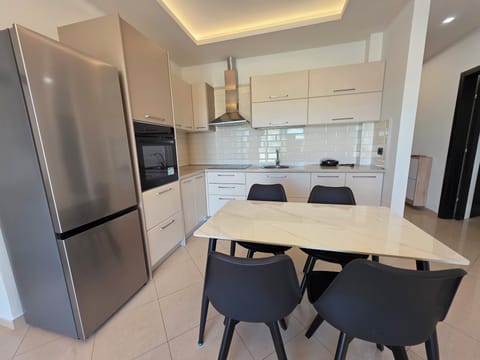Family Apartment, Partial Sea View | Private kitchen | Oven, stovetop, dishwasher, cookware/dishes/utensils