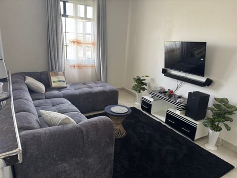 Comfort Apartment | Living area | 32-inch Smart TV with digital channels