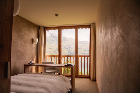 Hypo-allergenic bedding, desk, laptop workspace, blackout drapes