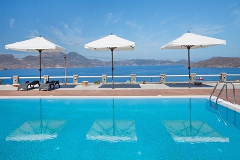 Outdoor pool, open 8:00 AM to 9 PM, pool umbrellas, sun loungers