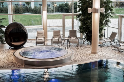 Indoor pool, outdoor pool, pool umbrellas, sun loungers