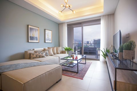 Apartment, 2 Bedrooms, Kitchen, City View | Living room | 55-inch Smart TV with cable channels, streaming services