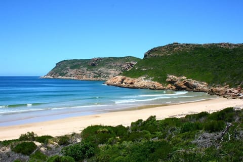 Beach nearby, white sand, beach towels