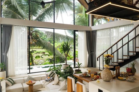 Deluxe Villa, Patio, Pool View | Living area