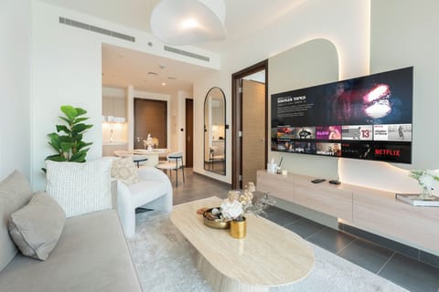 Deluxe Apartment, Balcony, Pool View | Living area | 65-inch Smart TV with digital channels, Netflix, streaming services