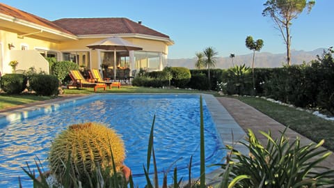 Outdoor pool, pool umbrellas, sun loungers