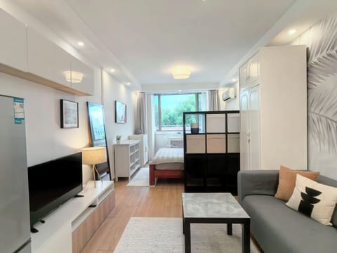 Standard Studio Suite, City View | Living area | 42-inch LCD TV with cable channels, offices