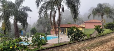 Classic Triple Room, Lanai, Garden View | Desk, laptop workspace, free WiFi, bed sheets