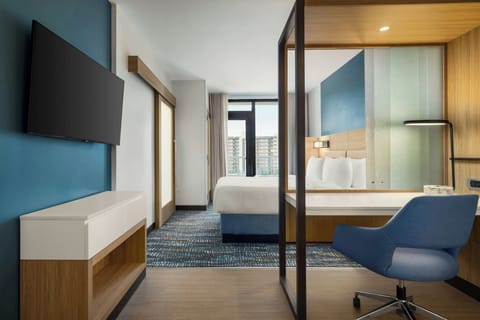 Suite, 1 King Bed with Sofa bed, Balcony, Poolside (View) | Hypo-allergenic bedding, desk, laptop workspace, iron/ironing board