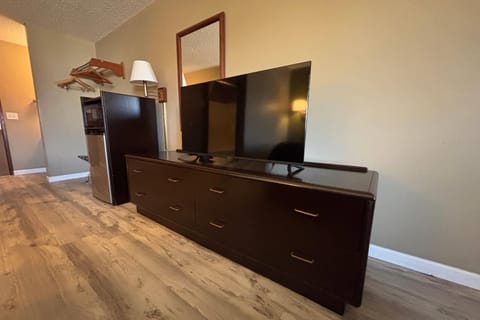 Desk, laptop workspace, blackout drapes, iron/ironing board