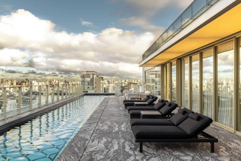 Outdoor pool, open 5:00 AM to 11:00 PM, sun loungers