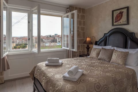Deluxe Double Room, City View | In-room safe, iron/ironing board, free WiFi
