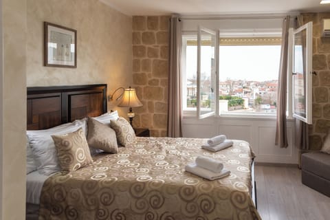 Deluxe Double Room, City View | In-room safe, iron/ironing board, free WiFi