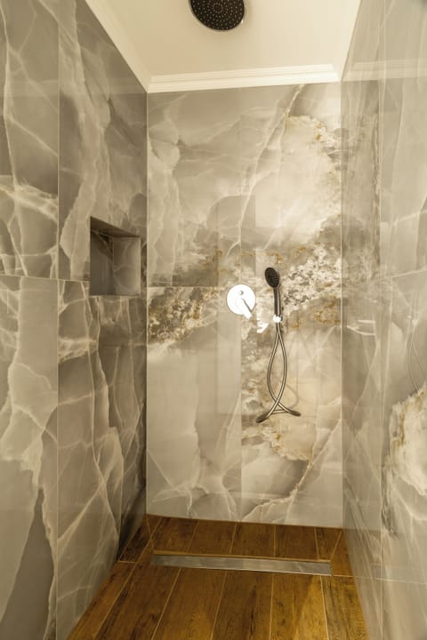 Comfort Double Room, 1 King Bed, Balcony, City View | Bathroom | Shower, hair dryer, slippers, towels