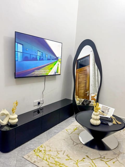 Deluxe Apartment, City View | Living area | Flat-screen TV