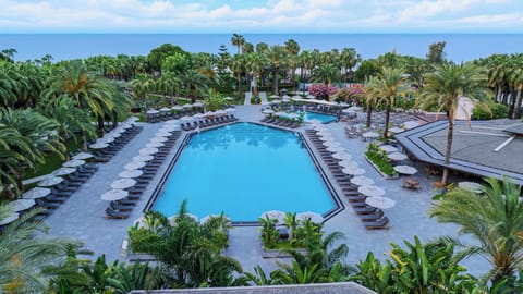 Indoor pool, outdoor pool, pool umbrellas, sun loungers