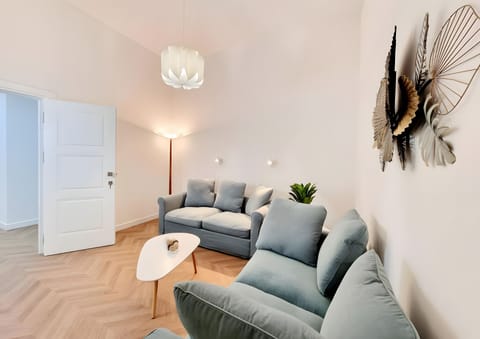 Deluxe Quadruple Room, Balcony, City View | Living area | TV