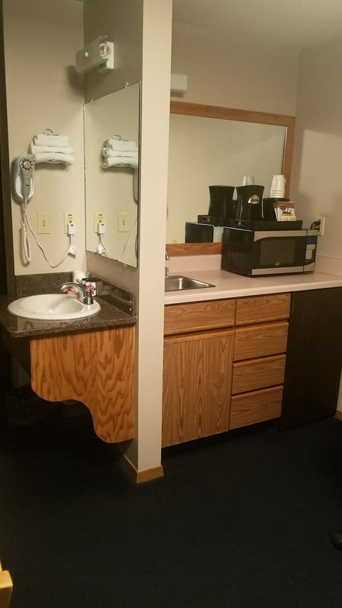 Suite, 1 King Bed, Non Smoking, Microwave | Bathroom sink