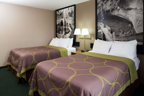 Desk, laptop workspace, iron/ironing board, free cribs/infant beds