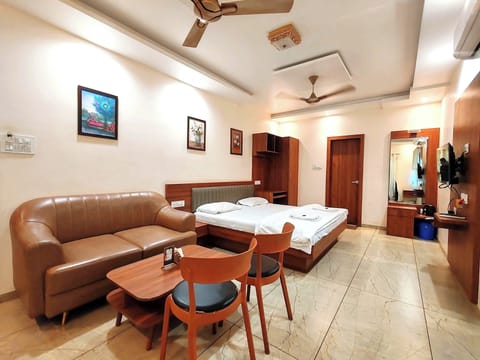 Deluxe Suite, Balcony, City View | Desk, laptop workspace