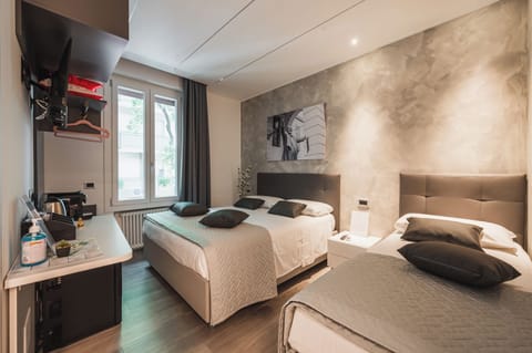 Comfort Triple Room, City View | Free minibar, in-room safe, desk, laptop workspace