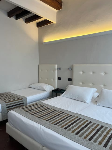 Quadruple Room, 1 Bedroom | In-room safe, desk, cribs/infant beds, free WiFi