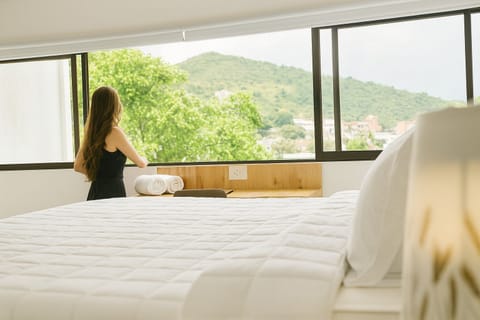 Luxury Studio Suite, Hill View | Desk, laptop workspace, iron/ironing board, free WiFi