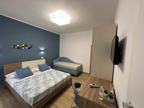 Standard Quadruple Room, Balcony, City View | In-room safe, blackout drapes, free WiFi