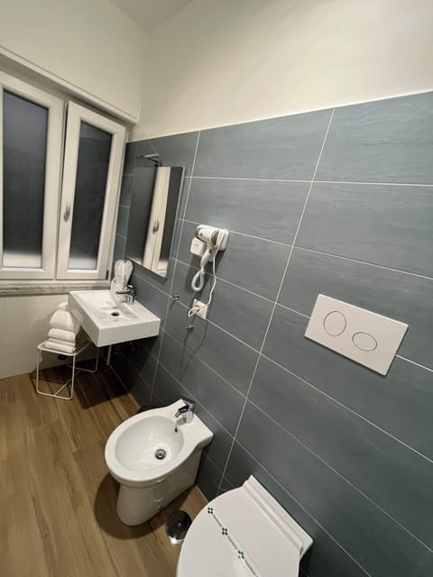 Superior Quadruple Room | Bathroom | Shower, hair dryer, towels, soap