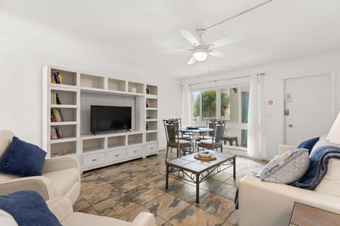 Comfort Condo, Pool View | Living area | 42-inch Smart TV with cable channels