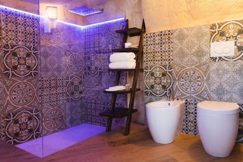 Deluxe Double Room, City View | Bathroom | Shower, free toiletries, hair dryer, slippers