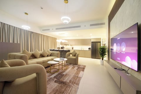 Deluxe Apartment, Balcony, City View | Living area | 64-inch LED TV with digital channels