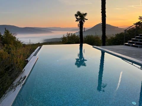 Outdoor pool, pool umbrellas, sun loungers