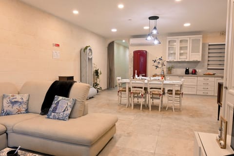 Family Apartment, Multiple Bedrooms (Valley Mist Apart NB 1 Xlendi Gozo) | Living area | 21-inch TV with digital channels