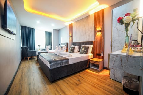 Family Triple Room, City View | Frette Italian sheets, premium bedding, down comforters