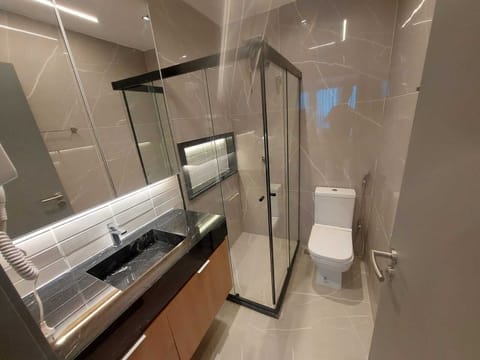 Standard Double Room, Partial Sea View | Bathroom | Shower, free toiletries, hair dryer, towels