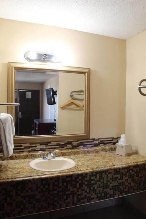 Bathtub, towels, soap, toilet paper